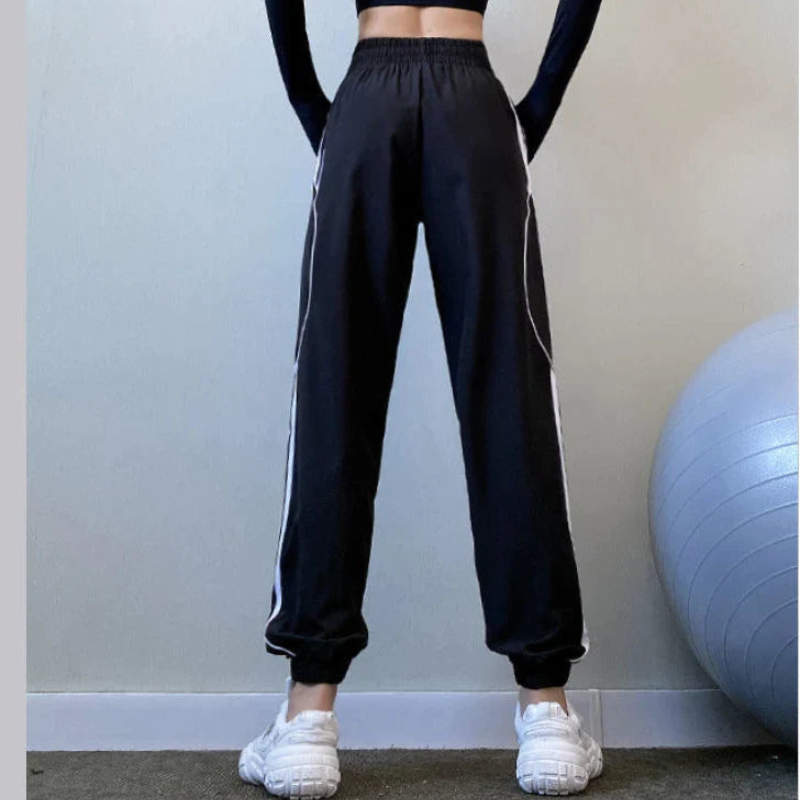 Emma – Lässige Hohe Taille Jogginghose mit Seitenstreifen und Taschen
