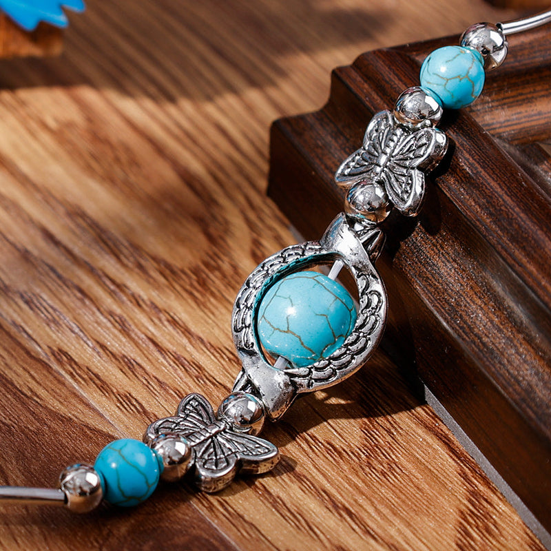 Milla – Verstellbares Schmetterlings Charm Armband mit einzigartigen Perlen