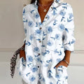 Clara – Langärmlige Blumenbluse mit Umlegekragen und Knopfleiste