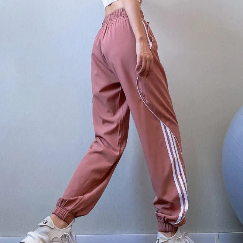 Emma – Lässige Hohe Taille Jogginghose mit Seitenstreifen und Taschen