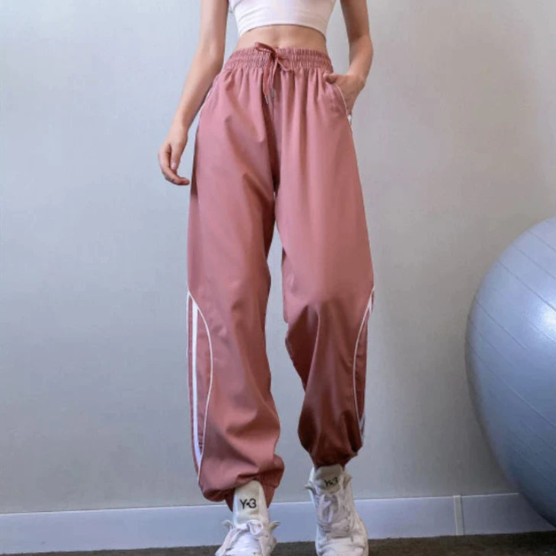 Emma – Lässige Hohe Taille Jogginghose mit Seitenstreifen und Taschen