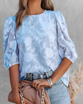 Rhea – Elegante Blumenbluse mit V-Ausschnitt und Puffärmeln