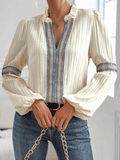 Mira – Lässige Bluse mit tiefem V-Ausschnitt und Puffärmeln