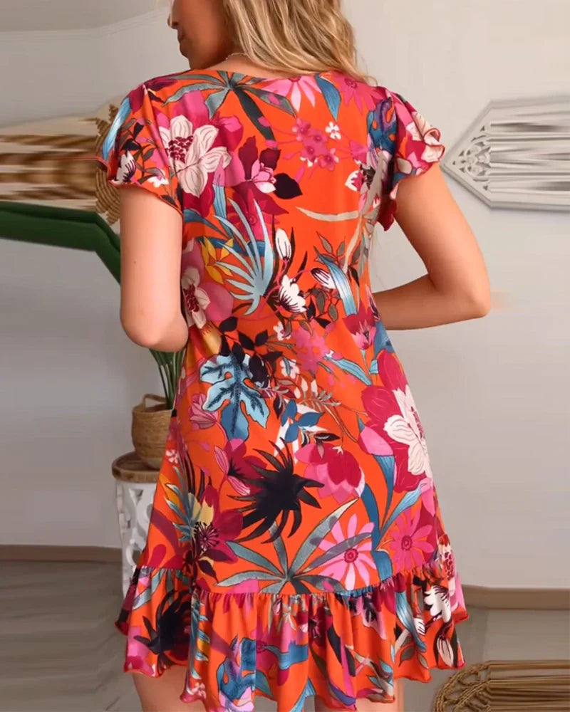Aria – Entspanntes Blumenkleid mit Rüschensaum und V-Ausschnitt