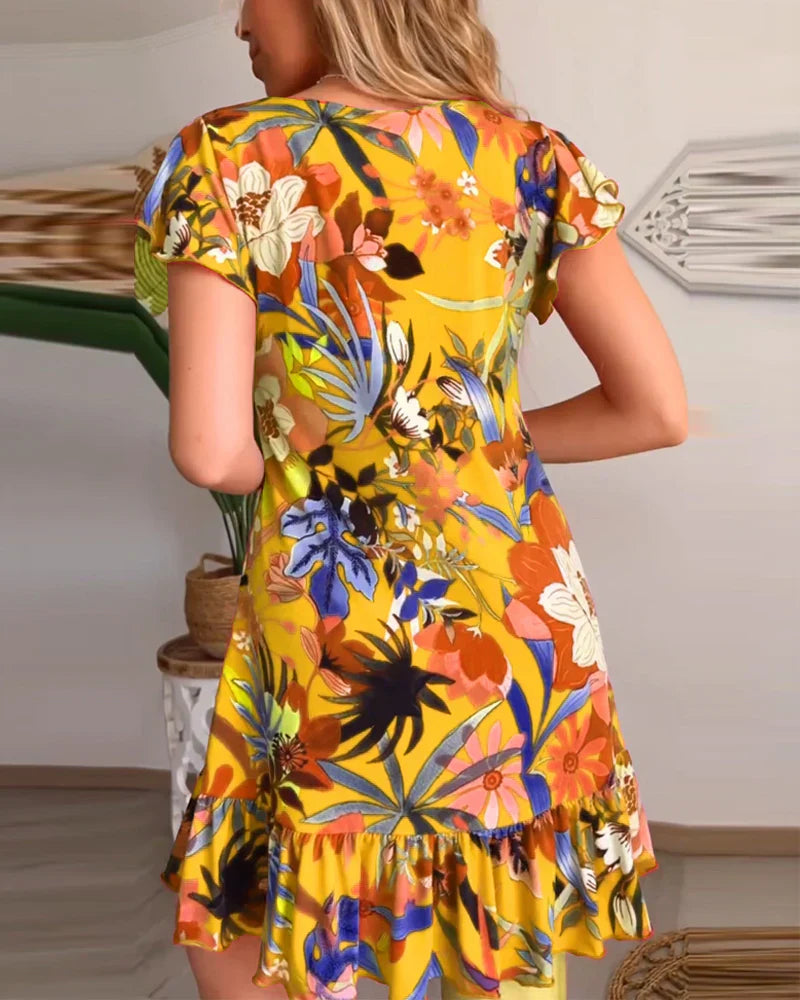 Aria – Entspanntes Blumenkleid mit Rüschensaum und V-Ausschnitt
