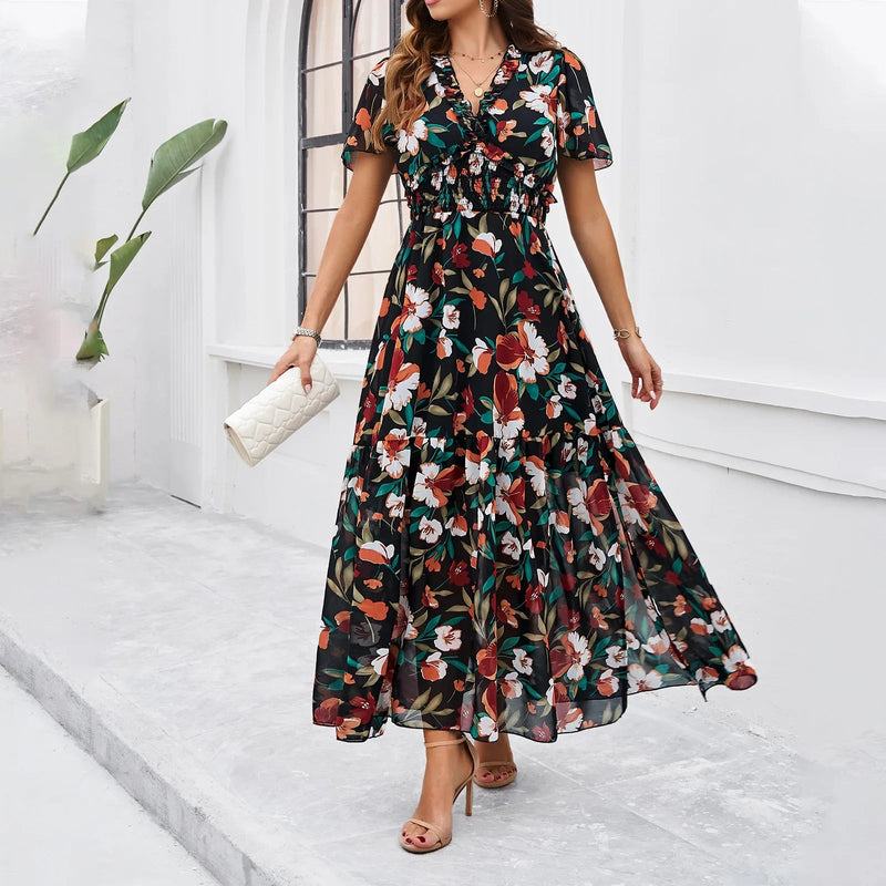 Elke – Stilvolles Kleid mit Blumendruck und V-Ausschnitt und ausgestellten Ärmeln