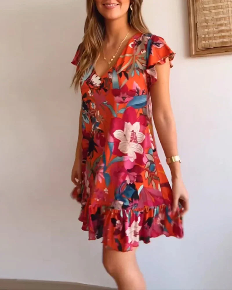 Aria – Entspanntes Blumenkleid mit Rüschensaum und V-Ausschnitt