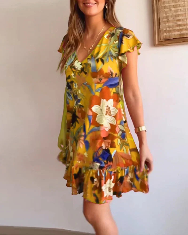 Aria – Entspanntes Blumenkleid mit Rüschensaum und V-Ausschnitt