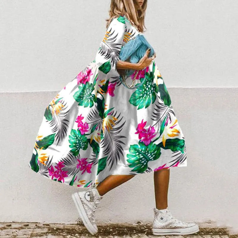 Naya – Elegantes fließendes Kleid mit halb Ärmeln und verspielten Drucken