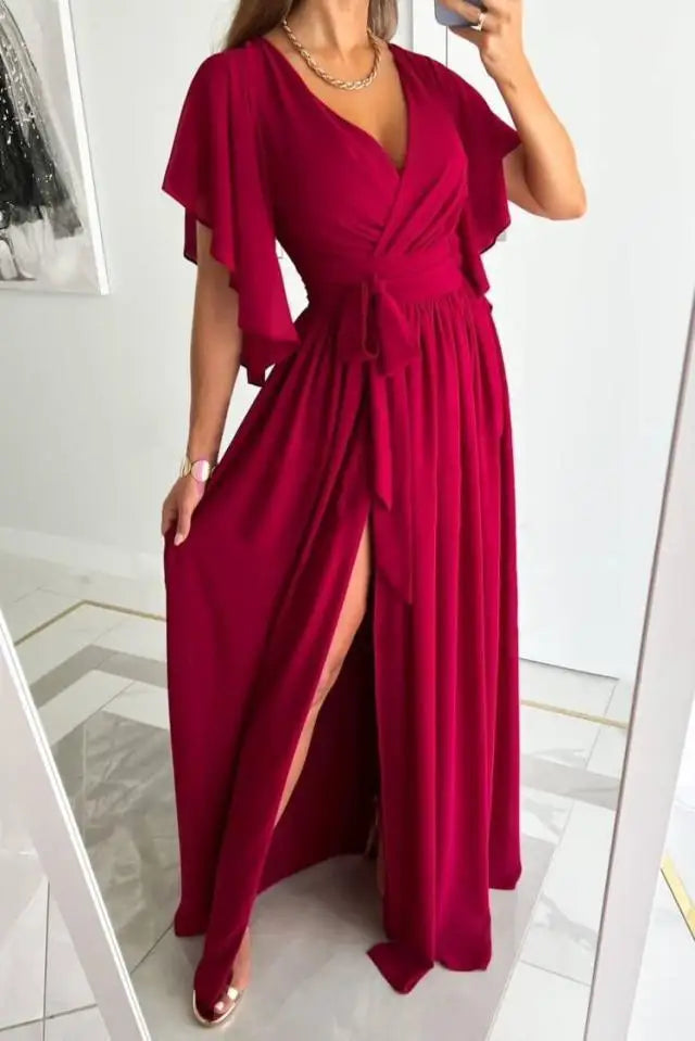 Renate – Modisches Kleid mit tiefem V Ausschnitt ausgestellten Ärmeln und seitlichem Schlitz