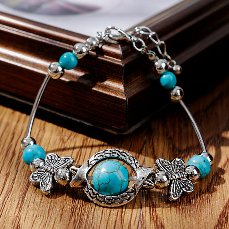 Milla – Verstellbares Schmetterlings Charm Armband mit einzigartigen Perlen