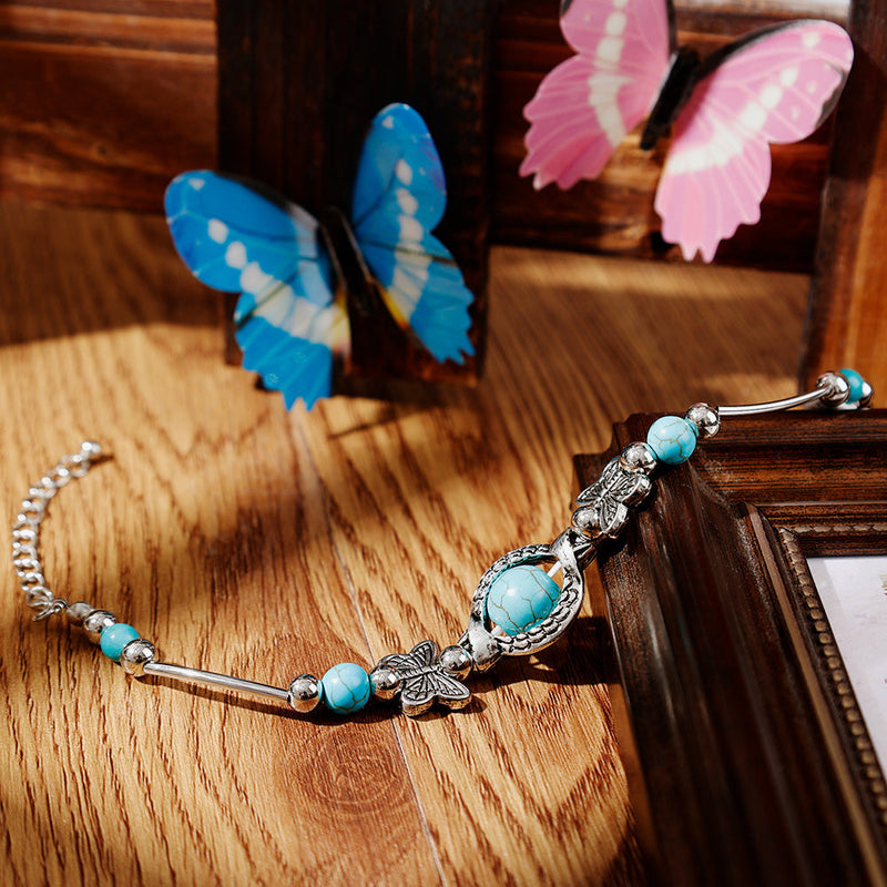 Milla – Verstellbares Schmetterlings Charm Armband mit einzigartigen Perlen