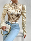 Amara – Blumenbluse mit hohem Ausschnitt und Puffärmeln