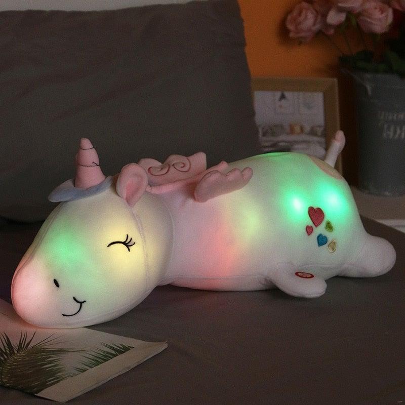 DreamGlow - Weiches und kuscheliges Regenbogen Einhorn Plüsch mit leuchtender Nachtlicht Funktion