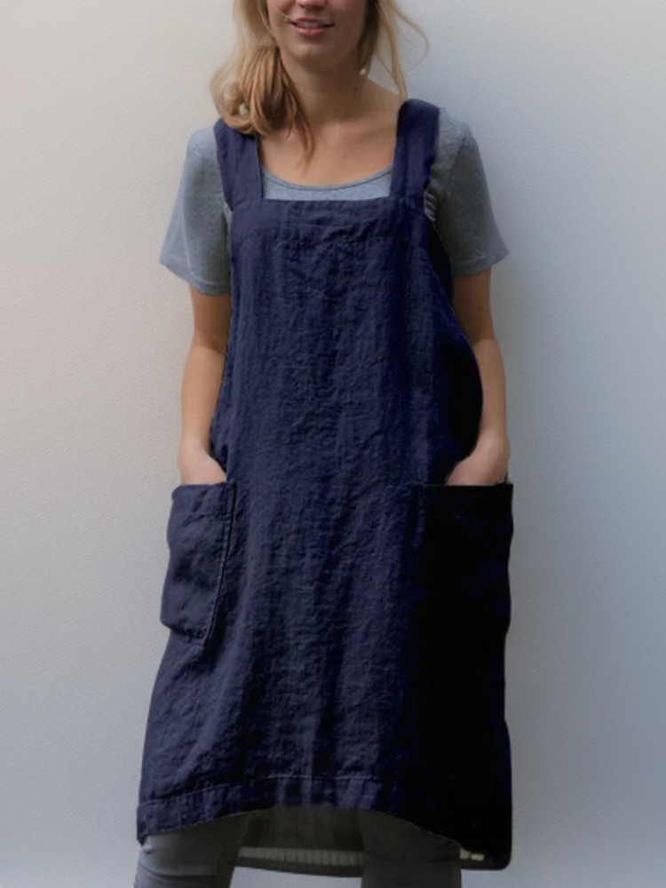 Elina – Luftiges Schürzenkleid mit fließender Form und raffinierten Taschendetails
