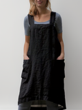Elina – Luftiges Schürzenkleid mit fließender Form und raffinierten Taschendetails